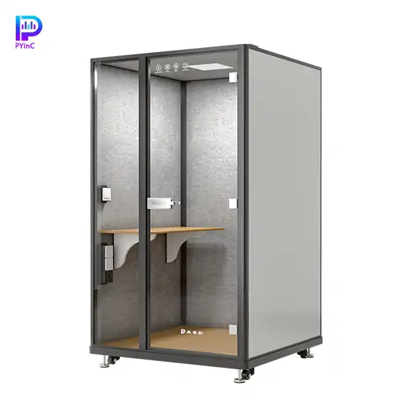 PYinC single-person soundproof office pod in black and white, with a desk, front glass panel, and right-opening door.