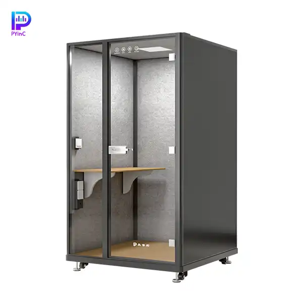 PYinC single-person soundproof office pod in black, with a desk, front glass panel, and right-opening door.
